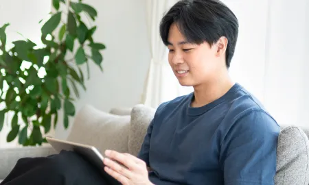 Watching an online session on a tablet at home
